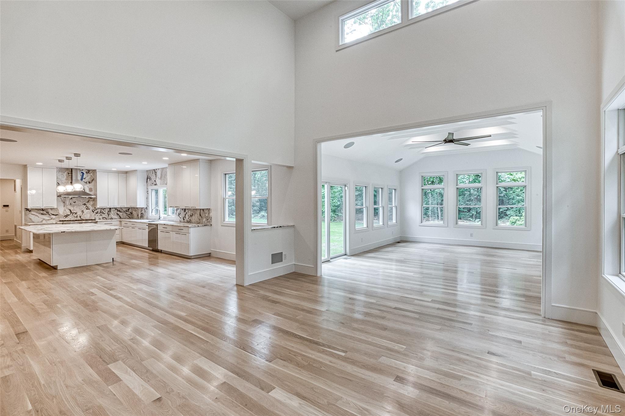 141 Old Cedar Swamp Road Jericho, NY 11753 - Photo 4 of 15 a view of a living room kitchen and a sink
