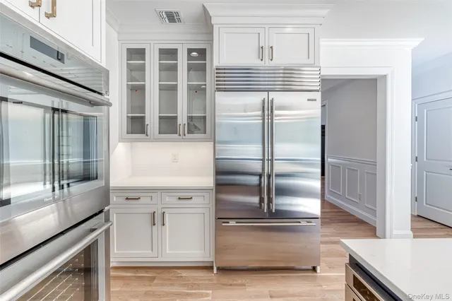 a kitchen with stainless steel appliances cabinets and a counter top