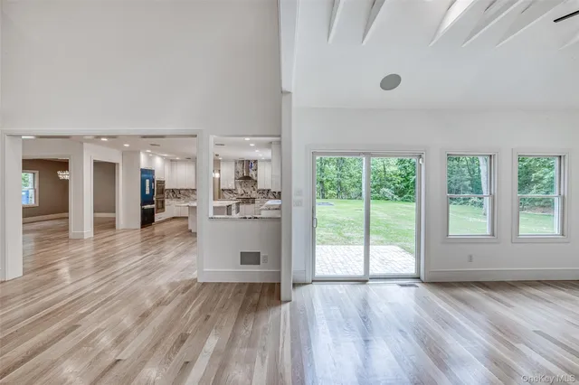 a view of a living room and windows