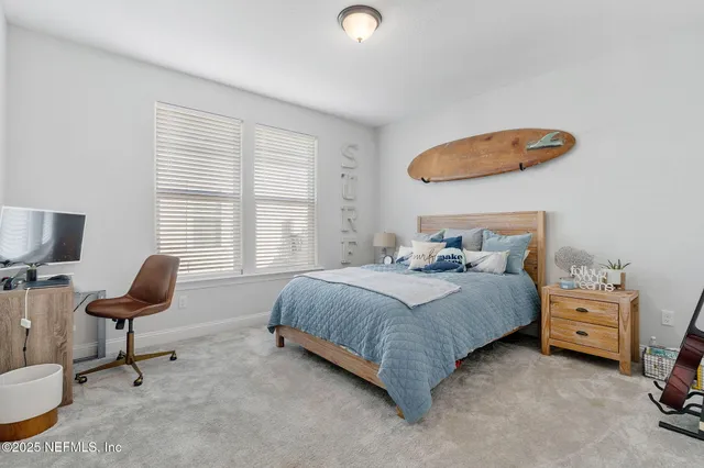 a bedroom with a bed and chair