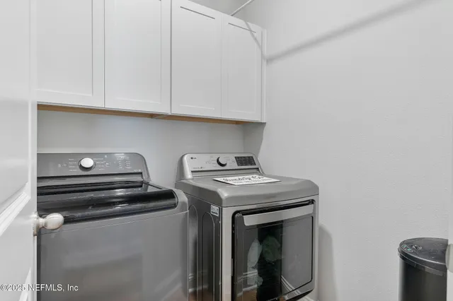 a view of a patio with couches table and chairs and potted plants