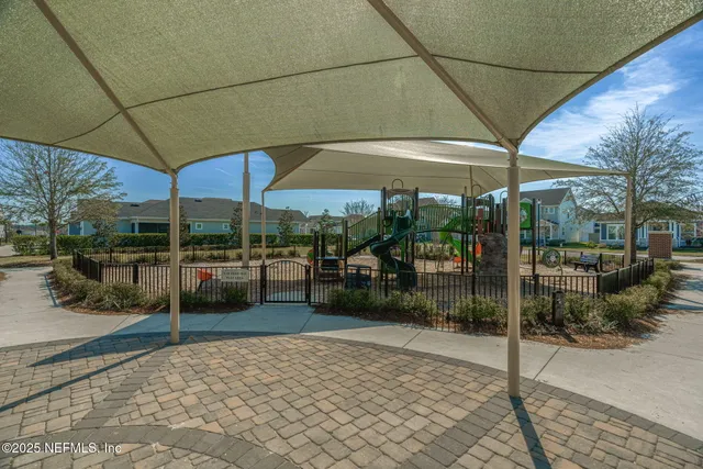 an aerial view of a house with a ocean view