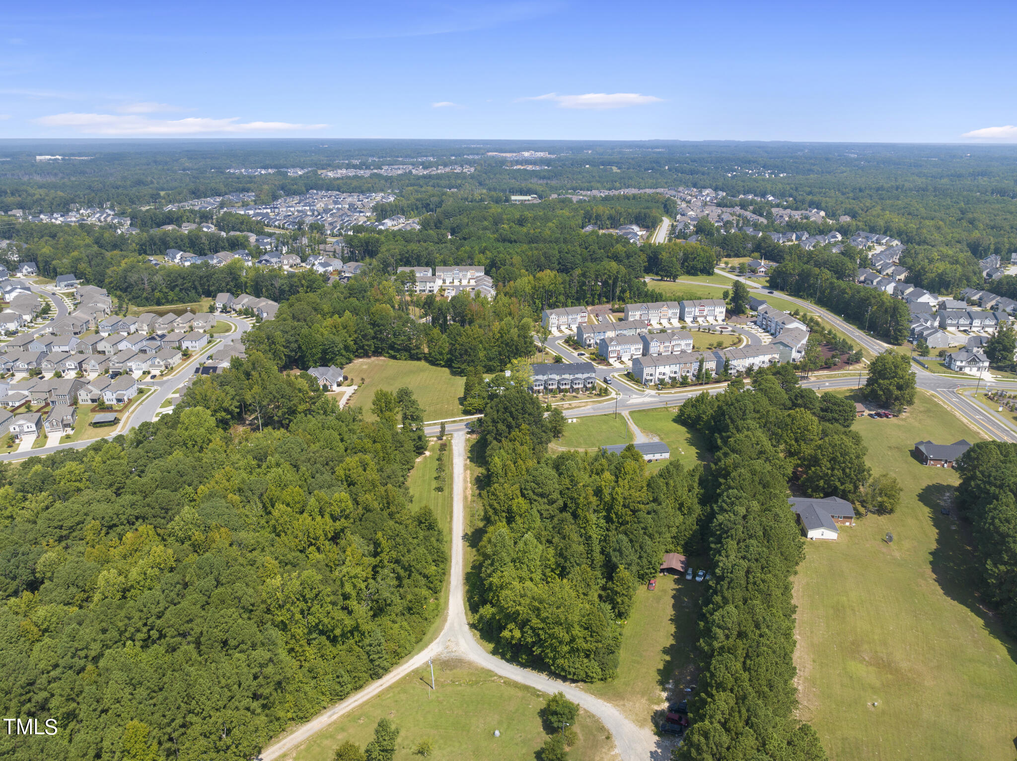 8129 Humie Olive Road Apex, NC 27502 - Photo 12 of 25 an aerial view of a house with a yard