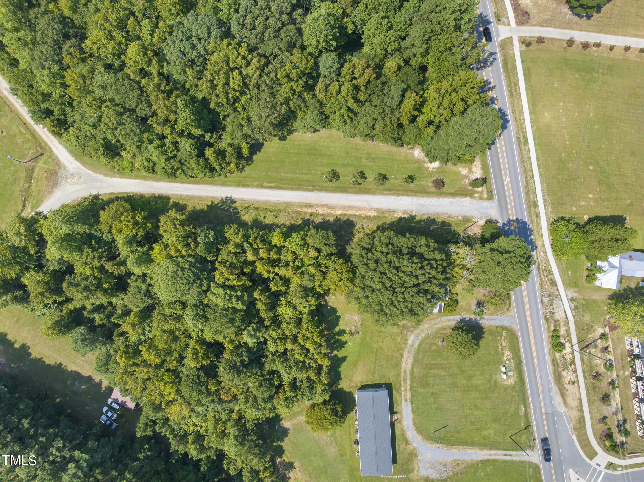 8129 Humie Olive Road Apex, NC 27502 - Photo 14 of 25 a view of a garden