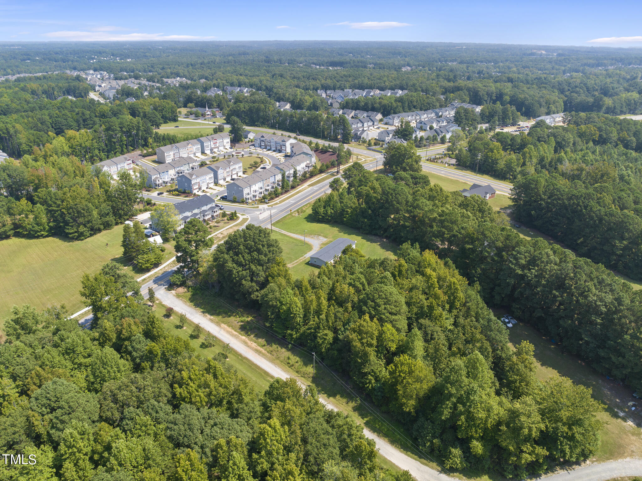 8129 Humie Olive Road Apex, NC 27502 - Photo 21 of 25 an aerial view of multiple house