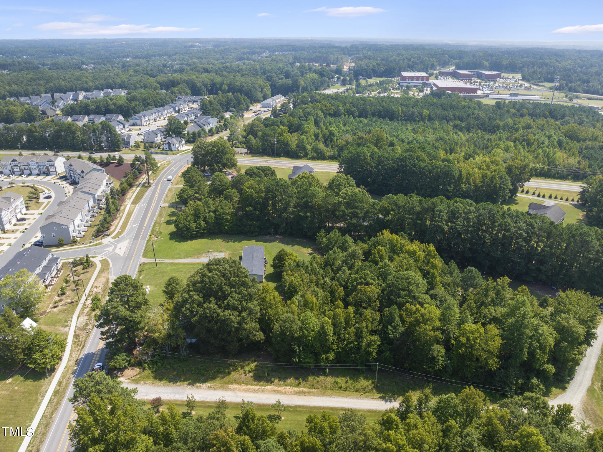 8129 Humie Olive Road Apex, NC 27502 - Photo 22 of 25 an aerial view of residential house with outdoor space and trees all around