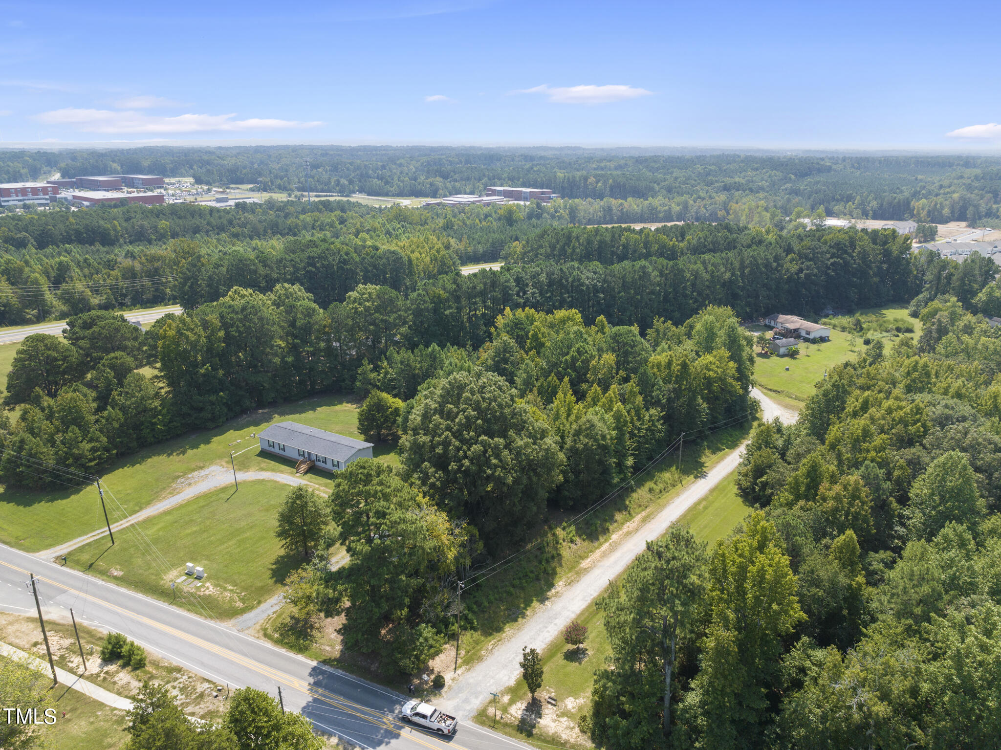 8129 Humie Olive Road Apex, NC 27502 - Photo 24 of 25 a view of a city with mountains in the background