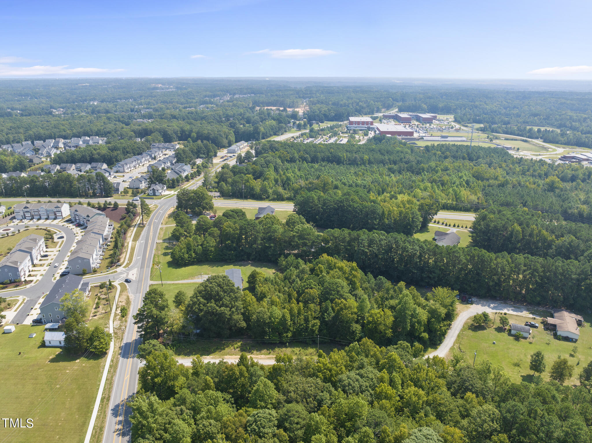 8129 Humie Olive Road Apex, NC 27502 - Photo 6 of 25 an aerial view of multiple house