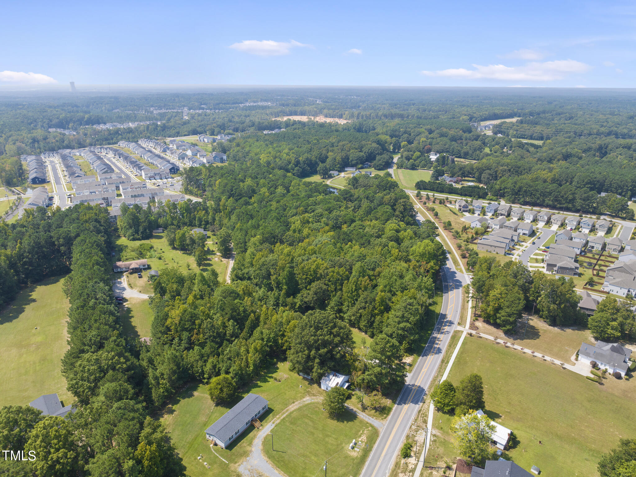 8129 Humie Olive Road Apex, NC 27502 - Photo 9 of 25 an aerial view of multiple house