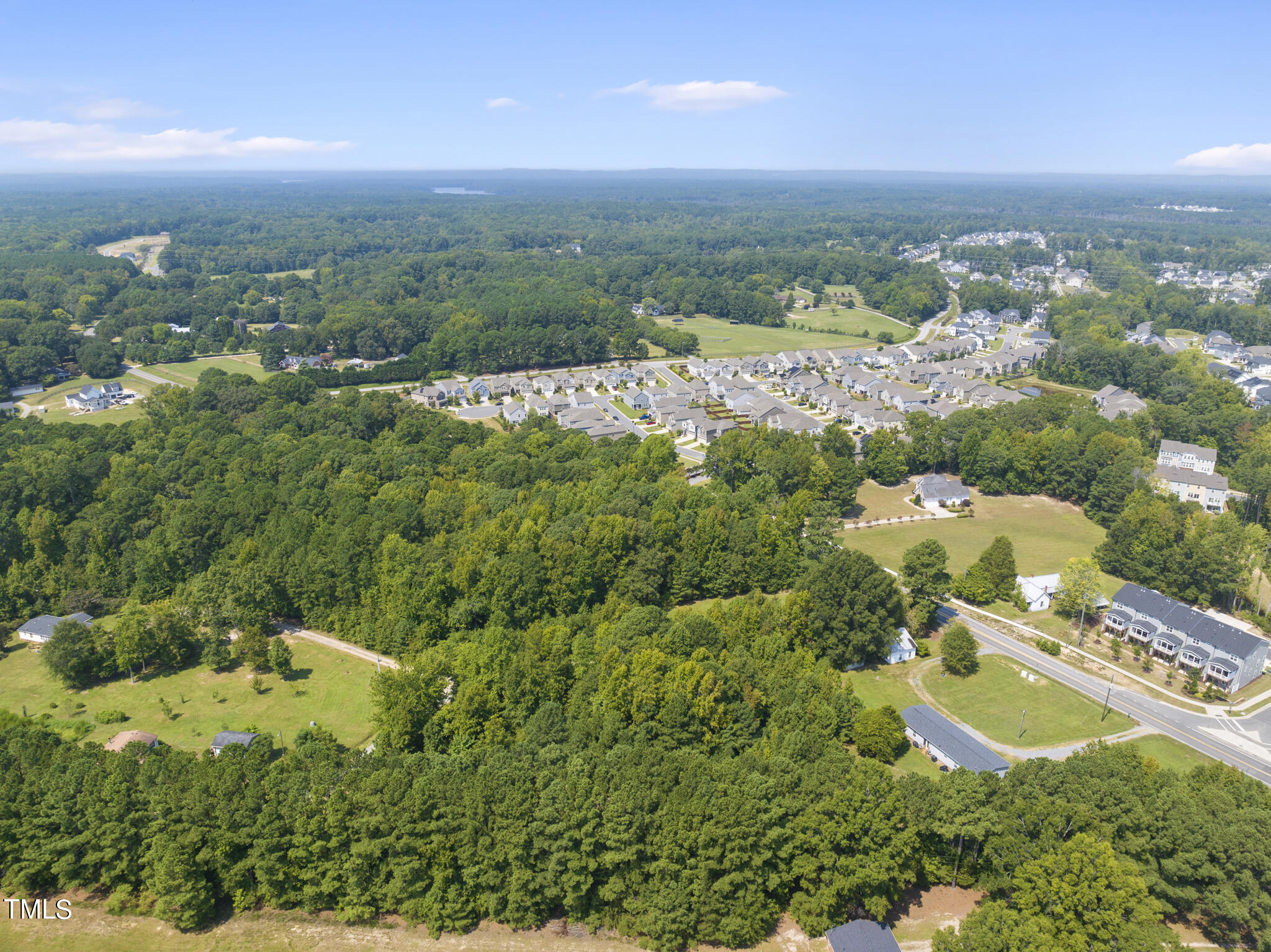 8129 Humie Olive Road Apex, NC 27502 - Photo 10 of 25 an aerial view of multiple house