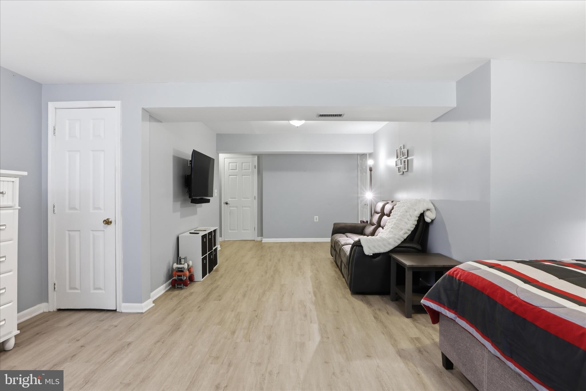 71 Kinsman View Circle Silver Spring, MD 20901 - Photo 15 of 42 a bedroom with bed and tv