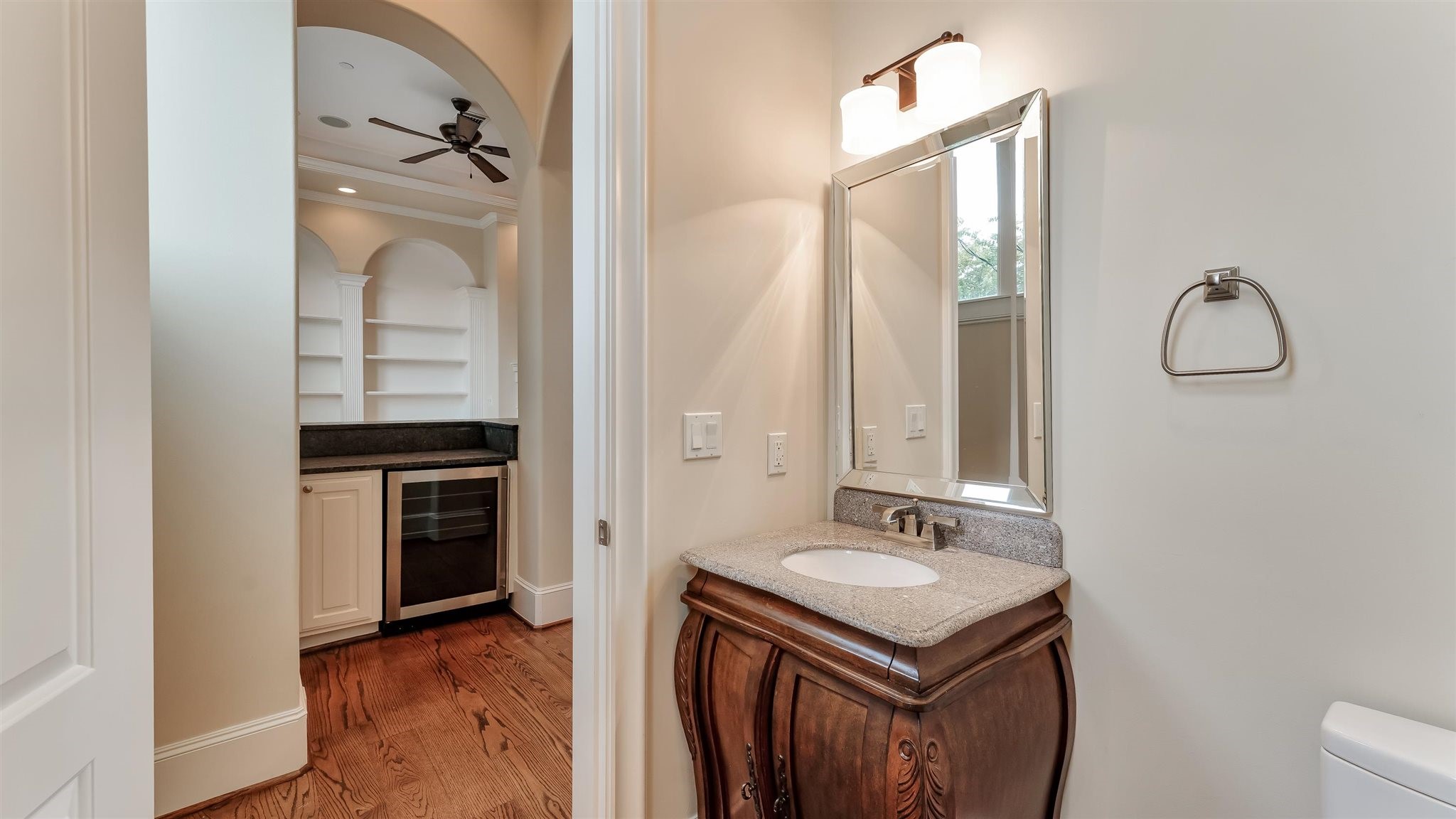 1700 Sunset Boulevard, Unit E Houston, TX 77005 - Photo 16 of 48 a bathroom with a sink vanity and a mirror