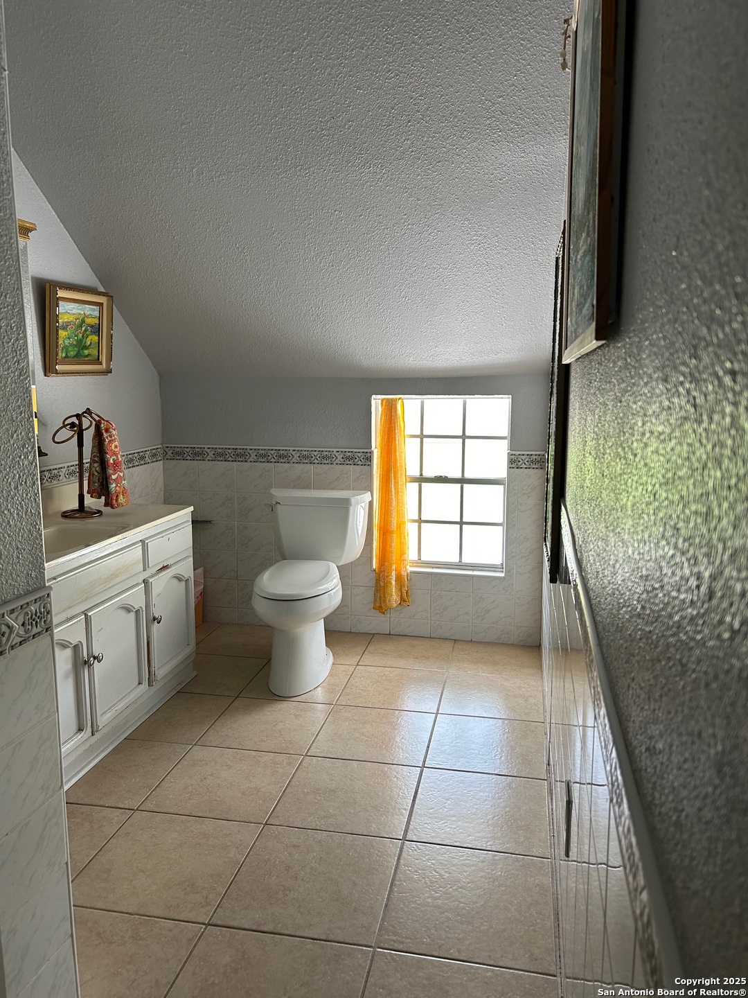 6 Collins Hill Road Lytle, TX 78052 - Photo 5 of 10 a kitchen with a sink a toilet and a window