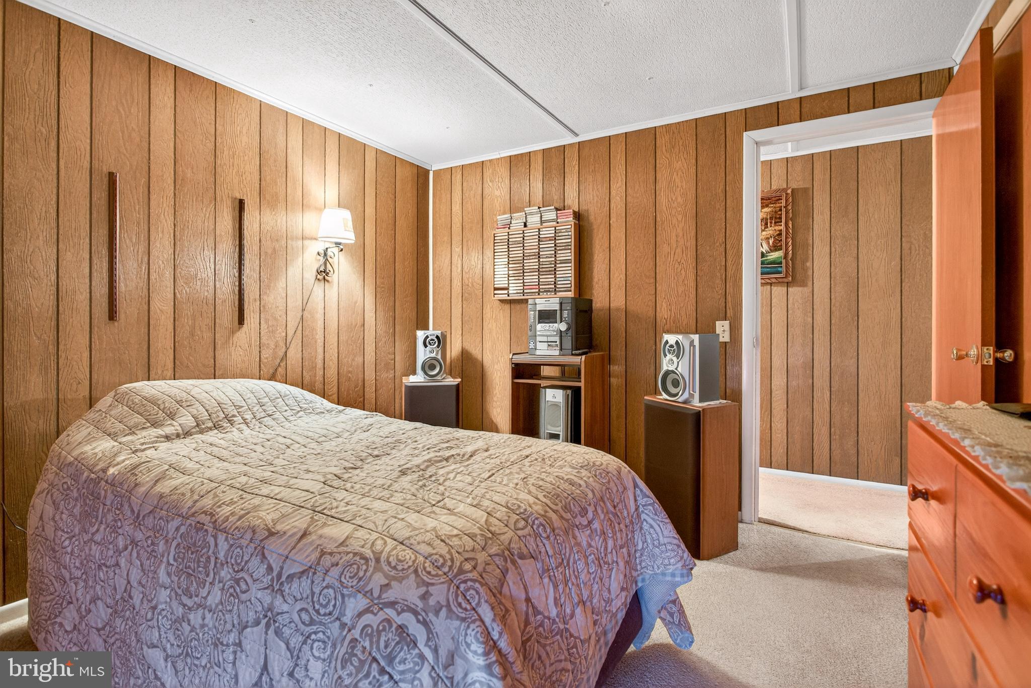 39 Commons Road Kutztown, PA 19530 - Photo 16 of 33 a spacious bedroom with a bed and a mirror