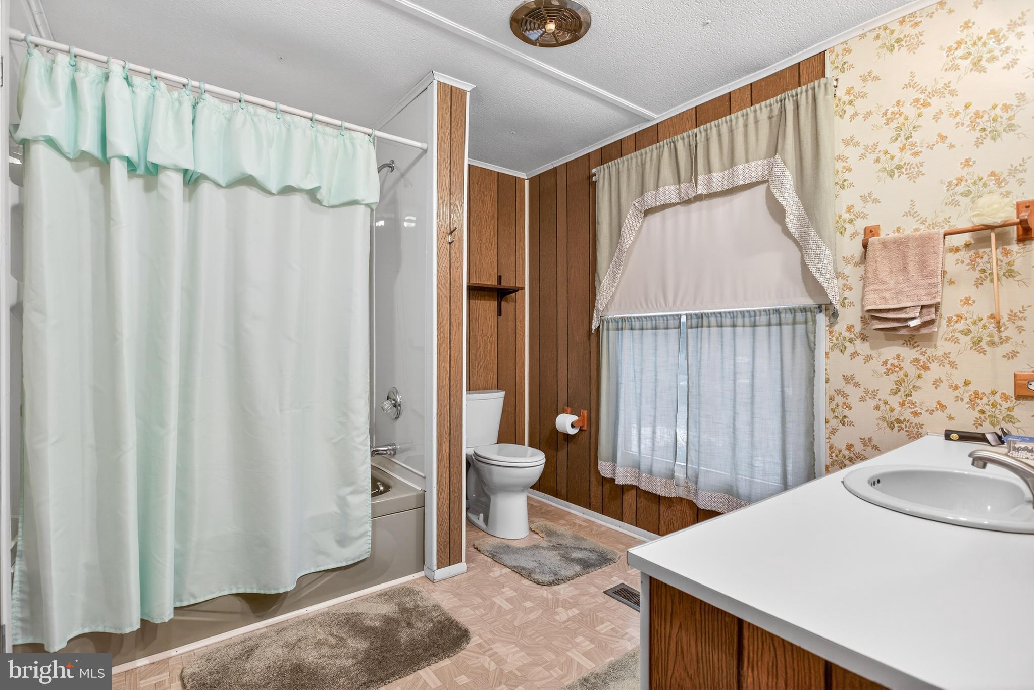 39 Commons Road Kutztown, PA 19530 - Photo 20 of 33 a bathroom with a granite countertop sink and a mirror