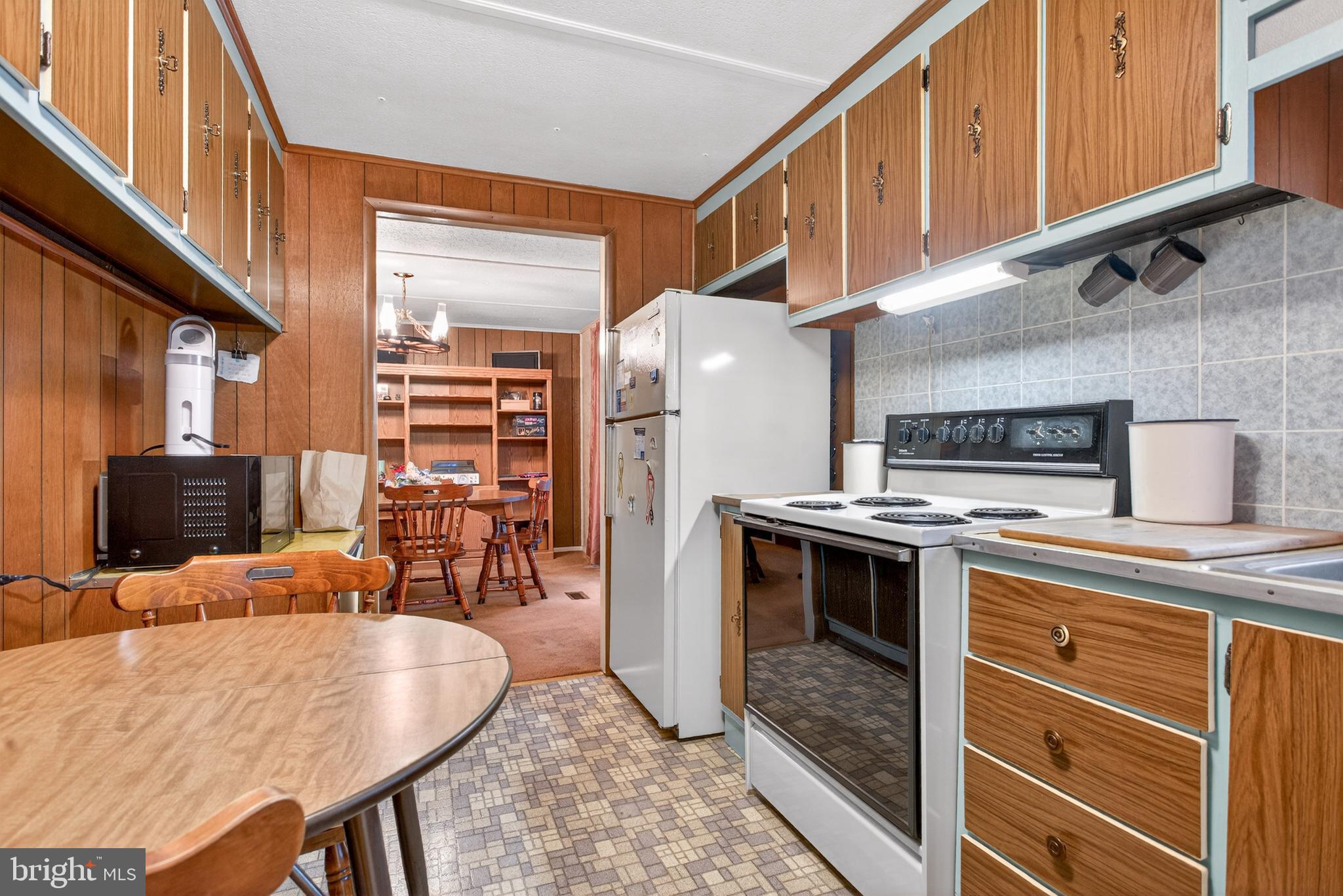 39 Commons Road Kutztown, PA 19530 - Photo 9 of 33 a kitchen with stainless steel appliances granite countertop a stove and a refrigerator