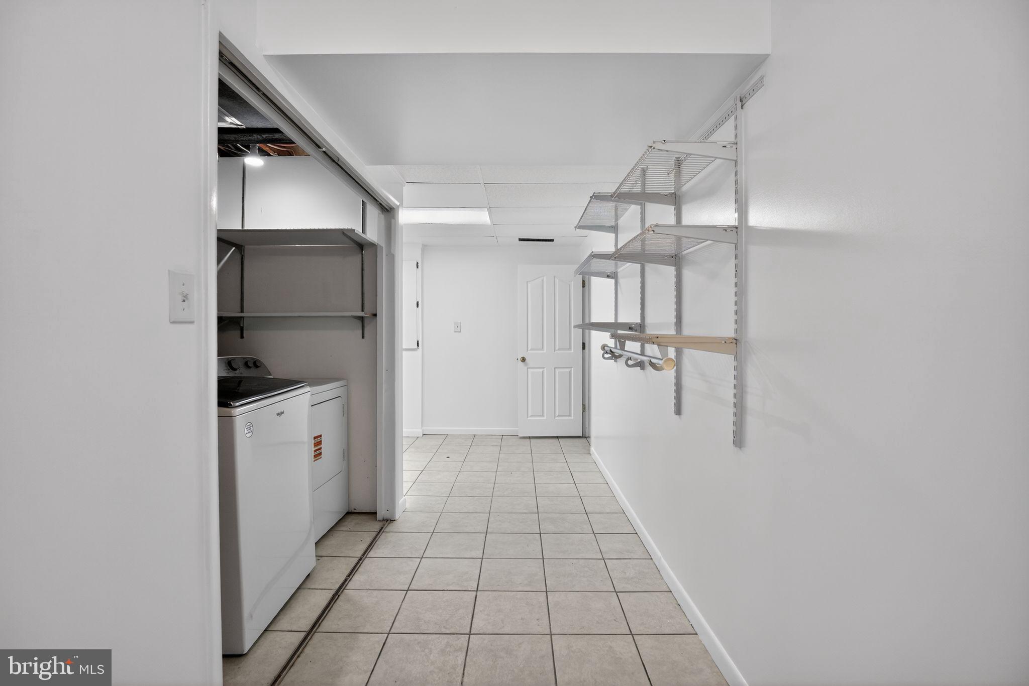 40855 Spring House Lane Leonardtown, MD 20650 - Photo 41 of 78 Lower Level 1, Laundry Closet & Storage Area