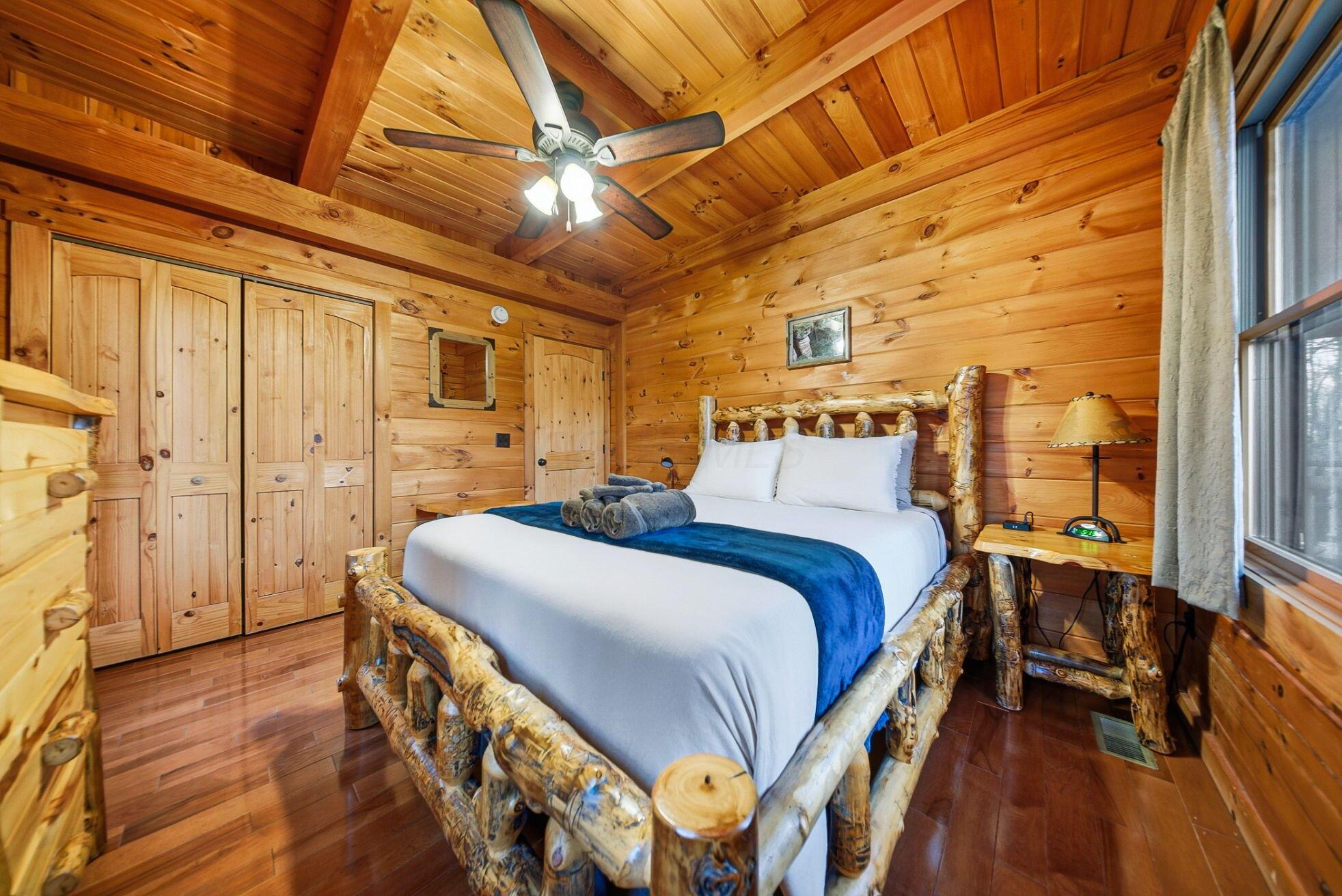 15399 Clapper Hollow Road Laurelville, OH 43135 - Photo 22 of 61 Main Level Bedroom with a Queen Bed and Custom Log Furniture
