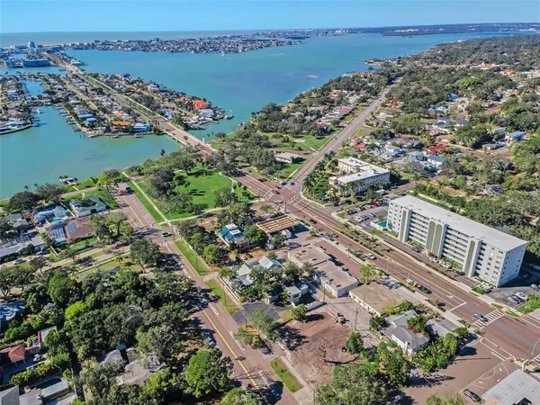 an aerial view of a city with ocean view