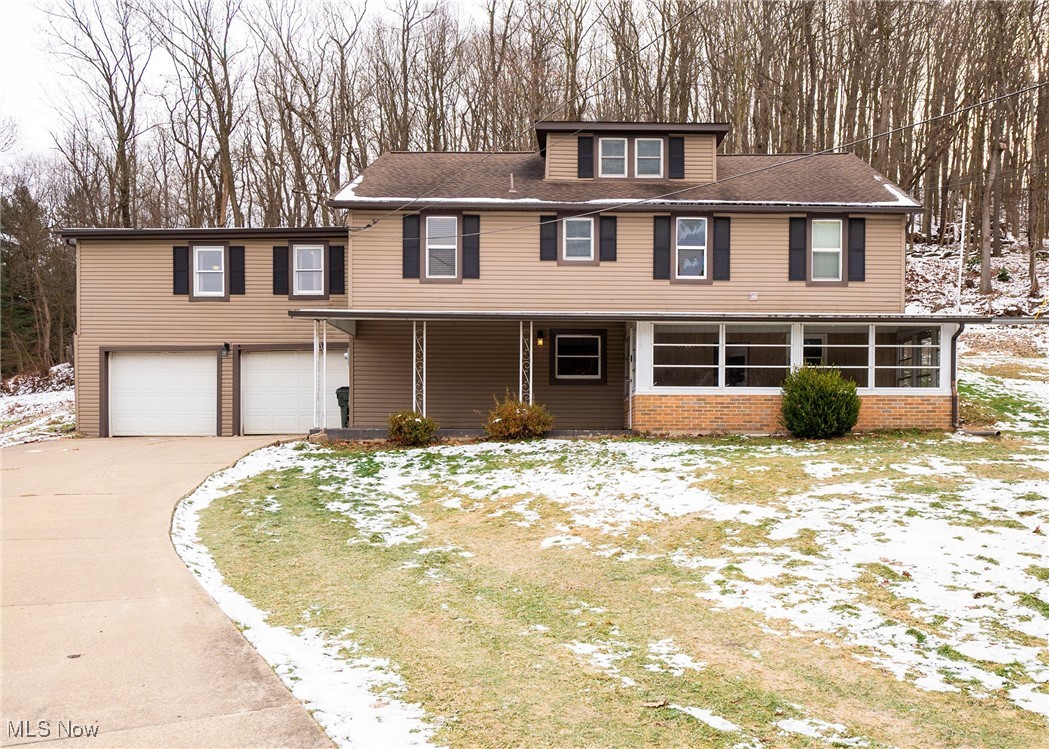 Front view of home with drive