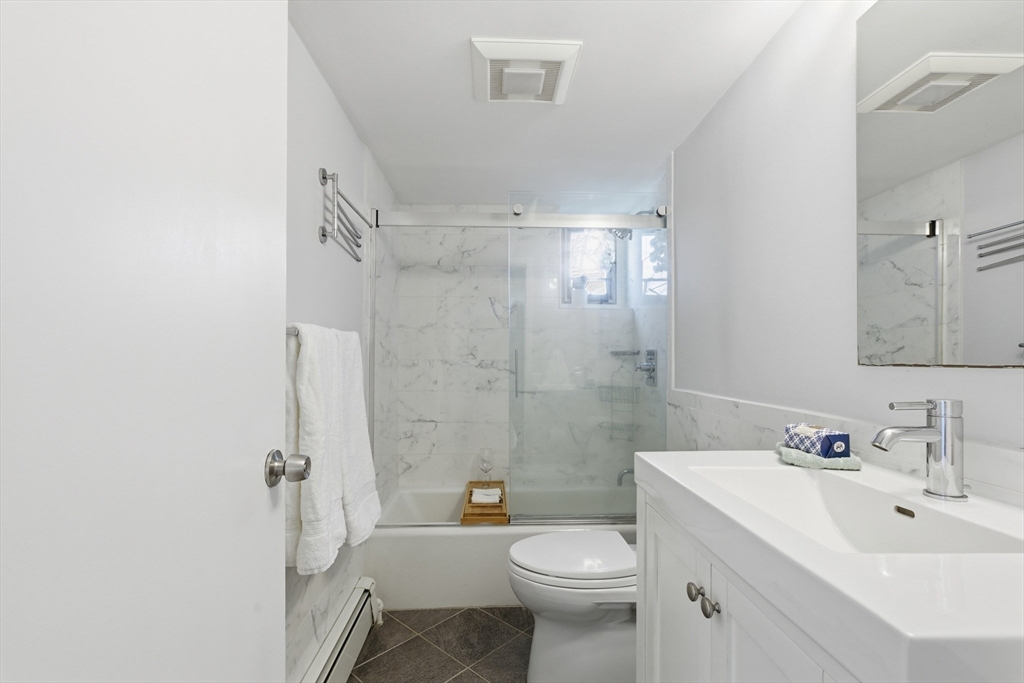 125 Trapelo Road, Unit U23 Belmont, MA 02478 - Photo 12 of 18 a bathroom with a sink toilet and shower