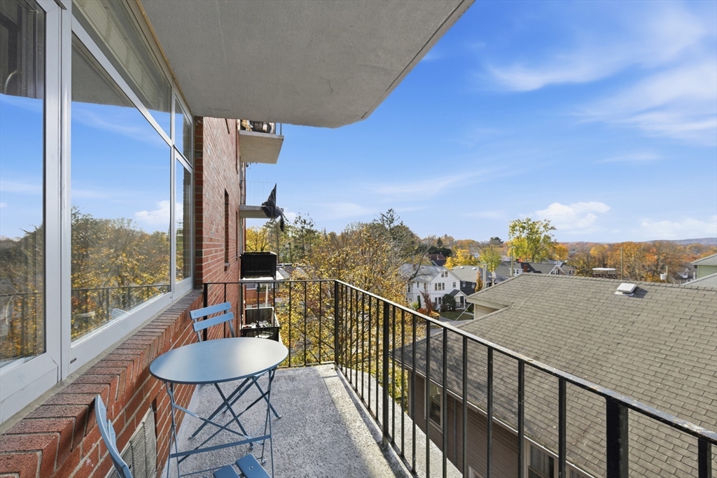 125 Trapelo Road, Unit U23 Belmont, MA 02478 - Photo 17 of 18 a view of a balcony with couches and wooden floor