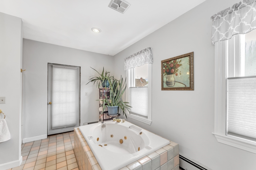 196 Maple Street Boston, MA 02132 - Photo 12 of 33 a bathroom with a tub and a shower