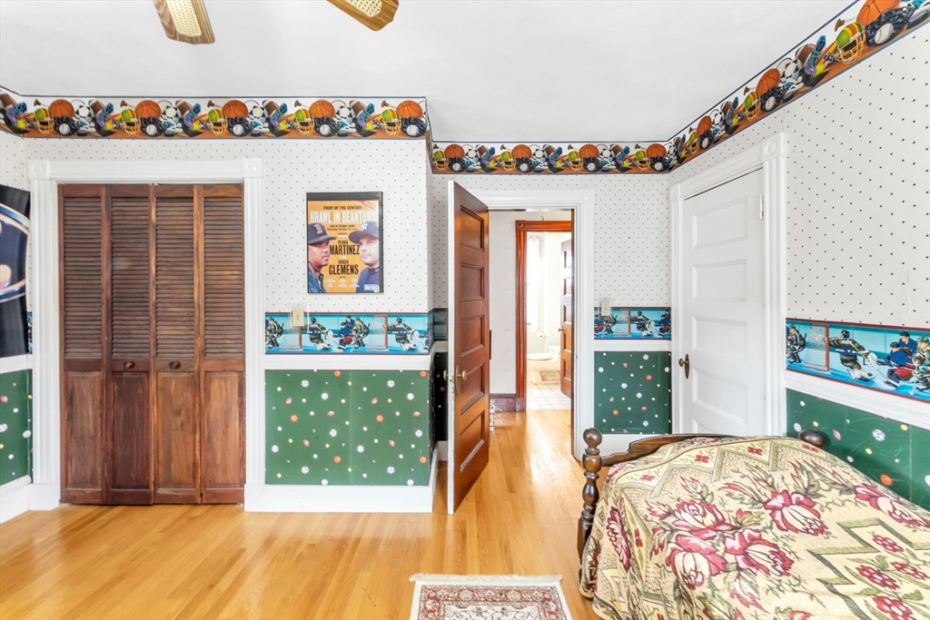 196 Maple Street Boston, MA 02132 - Photo 14 of 33 a bed room with a bed and a window