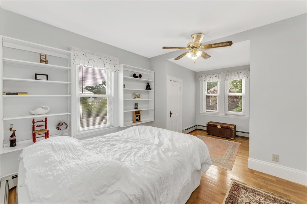 196 Maple Street Boston, MA 02132 - Photo 17 of 33 a bedroom with a bed and a window