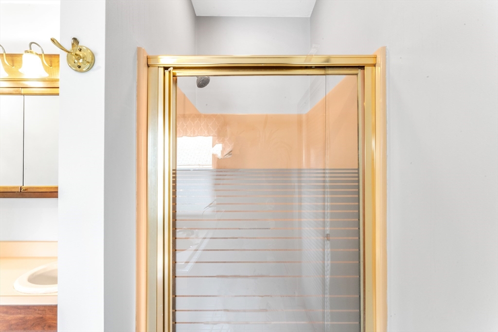 196 Maple Street Boston, MA 02132 - Photo 21 of 33 a bathroom with a shower and a window