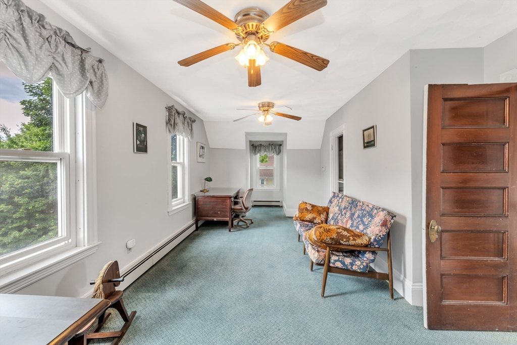 196 Maple Street Boston, MA 02132 - Photo 23 of 33 a living room with furniture and a window