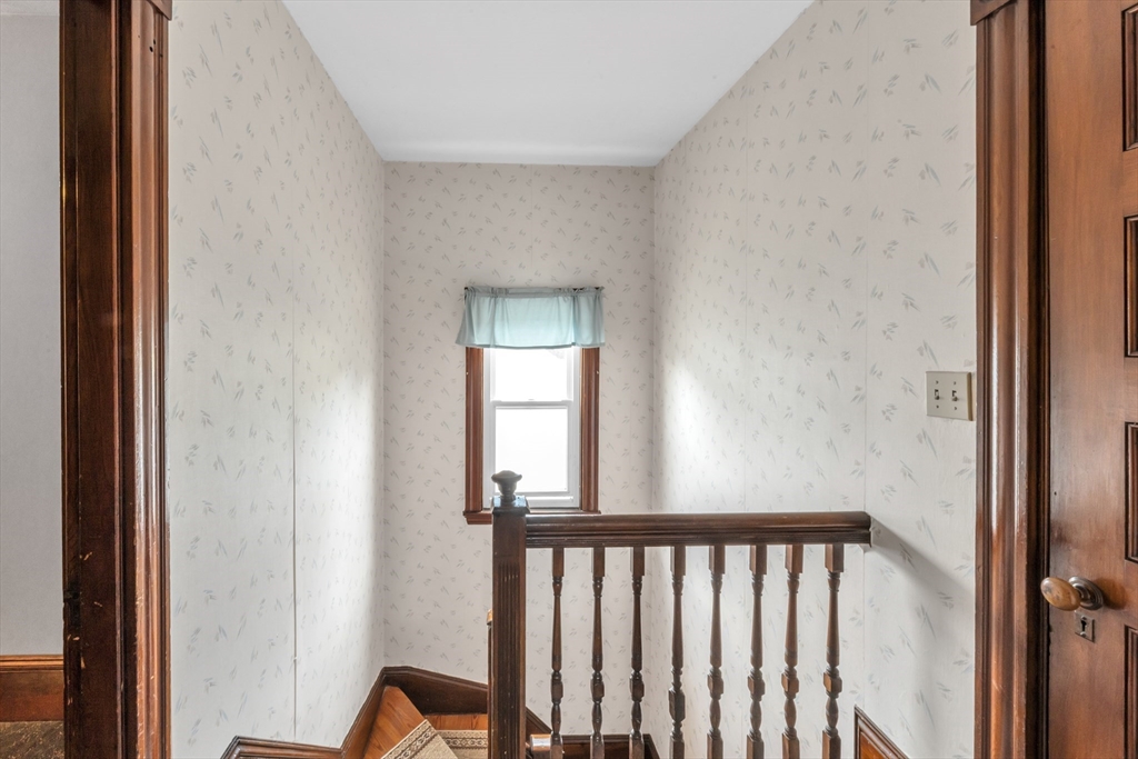 196 Maple Street Boston, MA 02132 - Photo 27 of 33 a view of a hallway