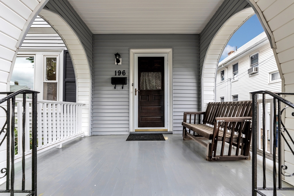 196 Maple Street Boston, MA 02132 - Photo 3 of 33 a view of a porch with furniture and stairs