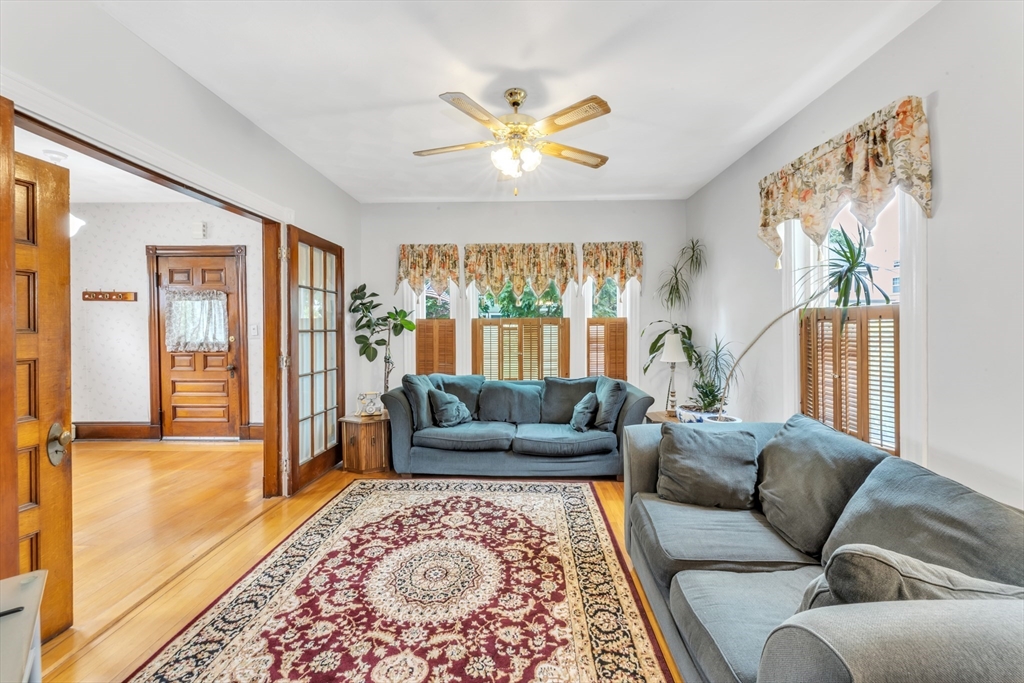 196 Maple Street Boston, MA 02132 - Photo 5 of 33 a living room with furniture and a large window