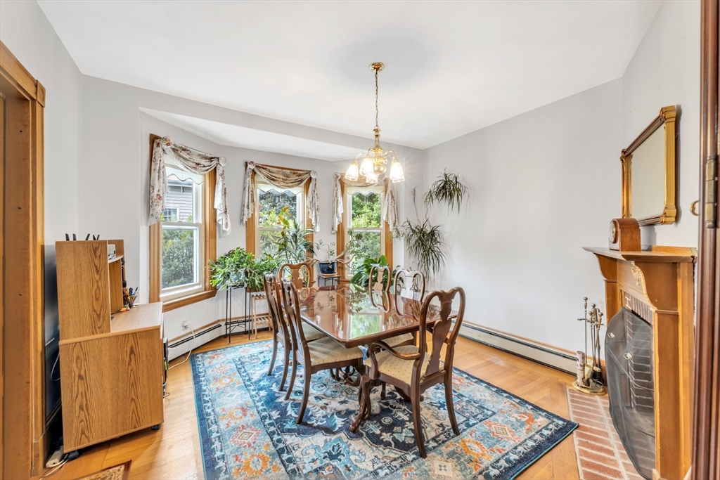 196 Maple Street Boston, MA 02132 - Photo 7 of 33 a view of a dining room with furniture window and wooden floor