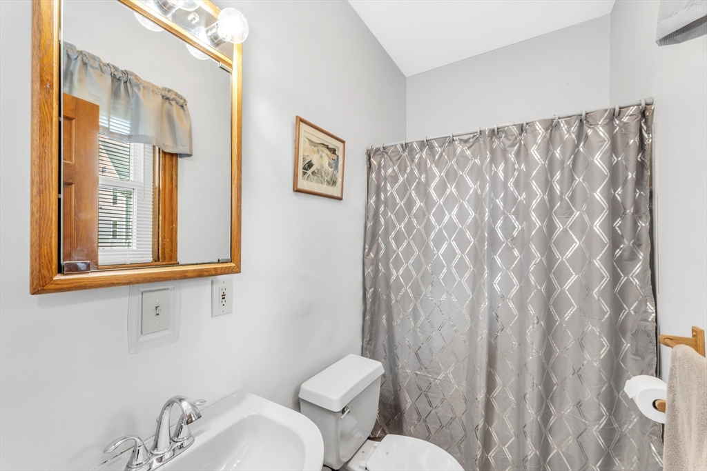 196 Maple Street Boston, MA 02132 - Photo 10 of 33 a bathroom with a toilet and a sink