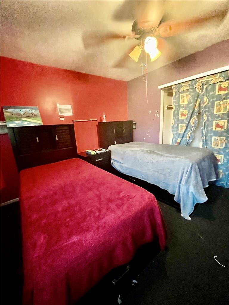 1012 East 172nd Street Bronx, NY 10460 - Photo 15 of 25 Carpeted bedroom with ceiling fan