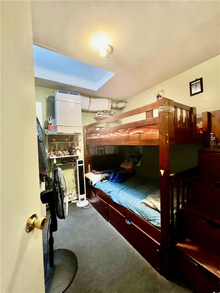 1012 East 172nd Street Bronx, NY 10460 - Photo 17 of 25 Carpeted bedroom with a skylight