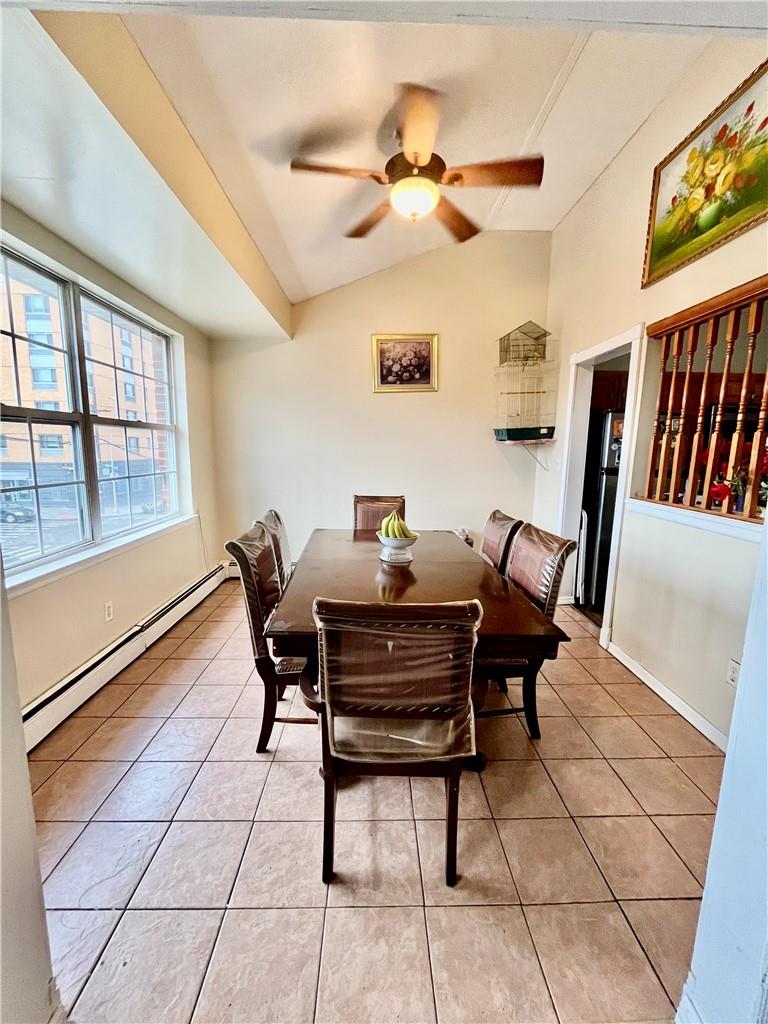 1012 East 172nd Street Bronx, NY 10460 - Photo 6 of 25 Tiled dining area with lofted ceiling, ceiling fan, and baseboard heating