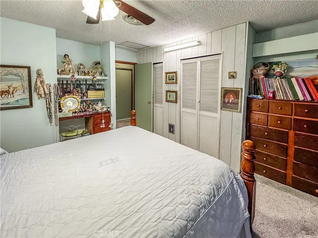 a living room with baby crib furniture and a wooden floor