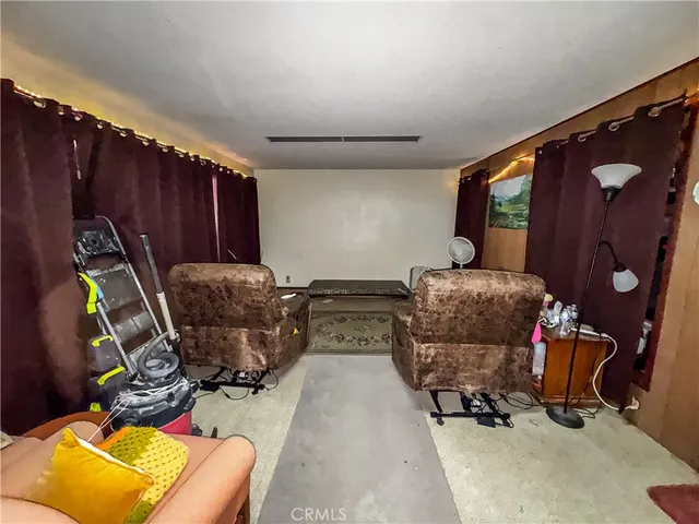 a view of room with furniture and a window