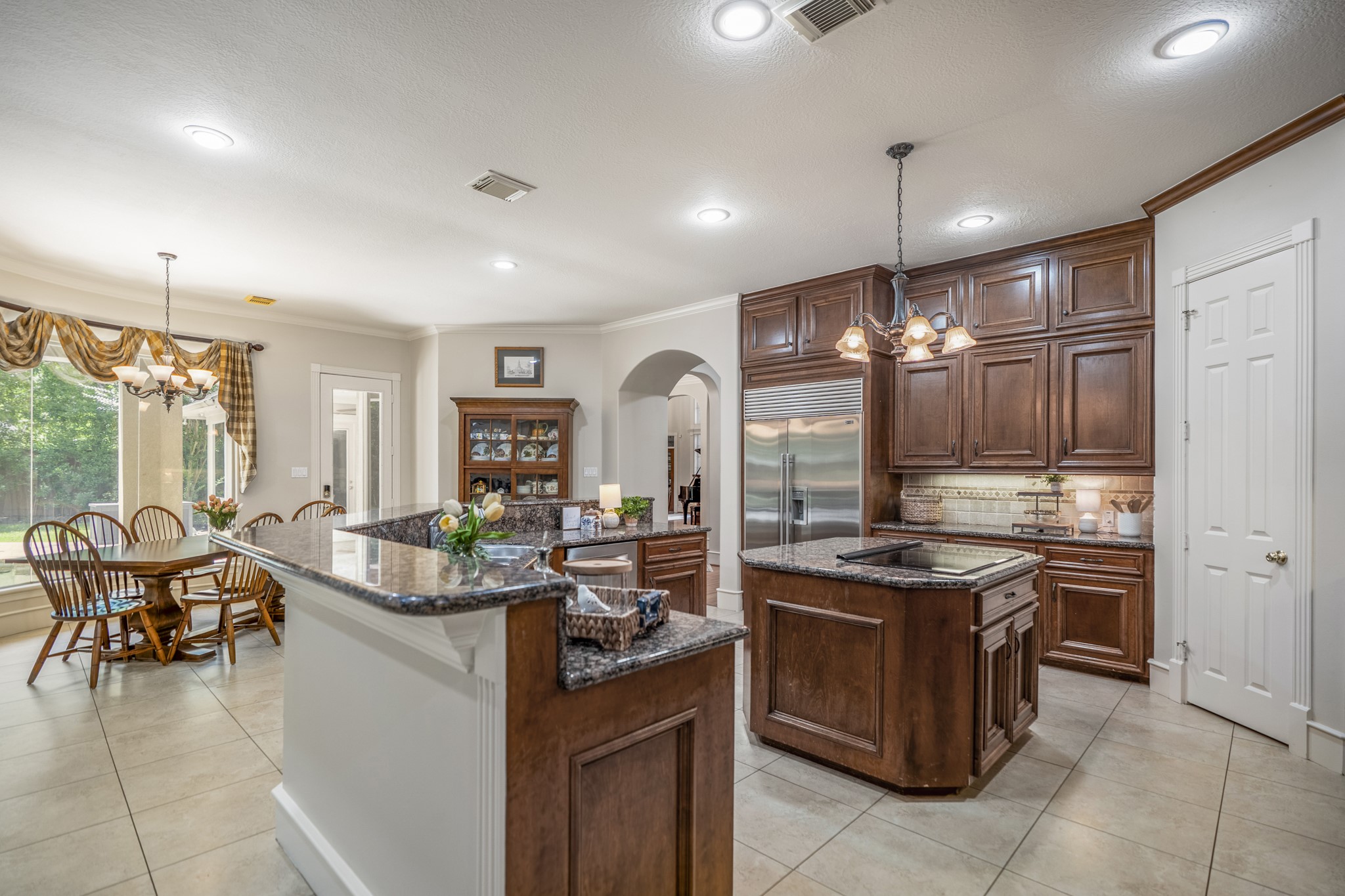 8806 Sterling Gate Circle Spring, TX 77379 - Photo 13 of 40 The kitchen appliances are top of the line with SubZero built in refrigerator and dacor stovetop, double ovens and microwave.