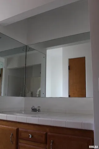 a kitchen with a cabinets and a stove top oven