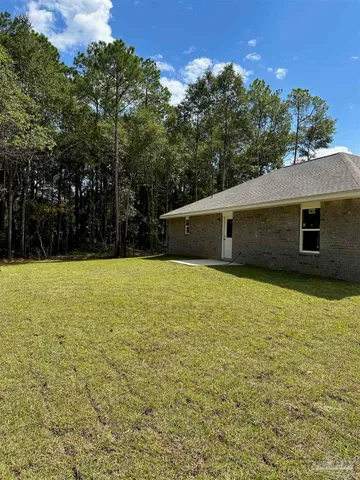 a backyard of a house with lots of green space