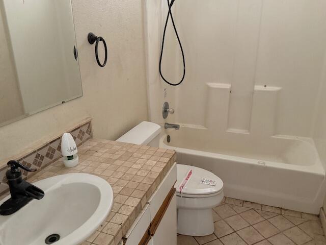 2620 Irwin Road Redding, CA 96002 - Photo 7 of 20 a bathroom with a granite countertop sink a toilet and bathtub