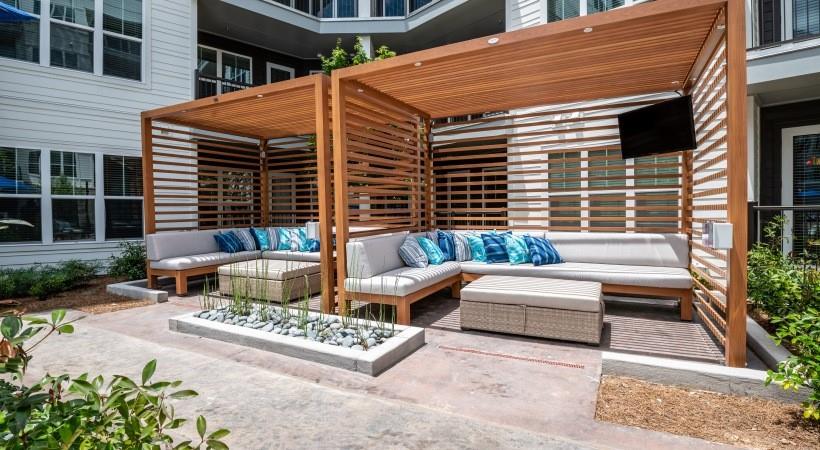 800 Galleria Parkway Southeast, Unit 457 Atlanta, GA 30339 - Photo 19 of 35 a view of a patio with couches table and chairs and potted plants