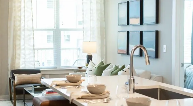 a dining room with furniture and window