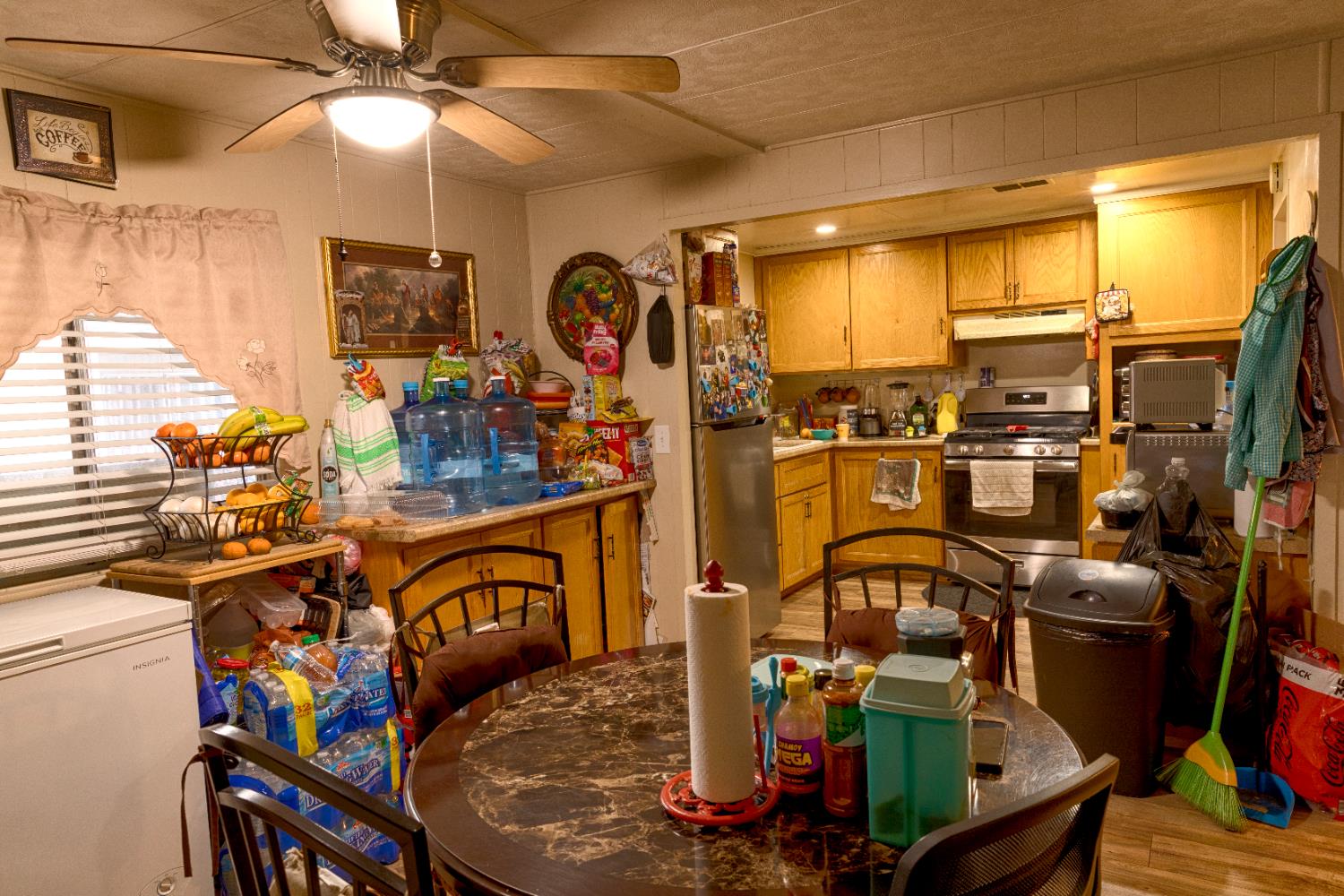 2500 North State Highway, Unit 239 Merced, CA 95348 - Photo 11 of 13 a view of a dining room with furniture a chandelier and large windows