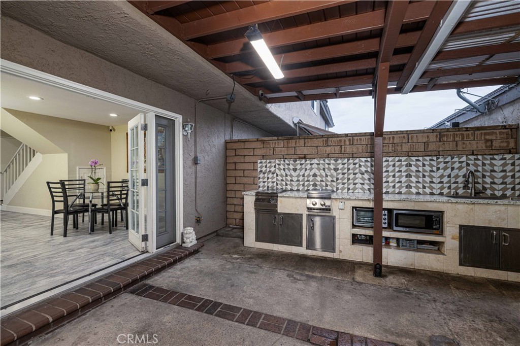 12279 Westcliff Drive Stanton, CA 90680 - Photo 12 of 26 a view of a kitchen with furniture fireplace and window