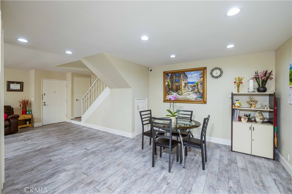 12279 Westcliff Drive Stanton, CA 90680 - Photo 13 of 26 a view of a dining room with furniture and wooden floor